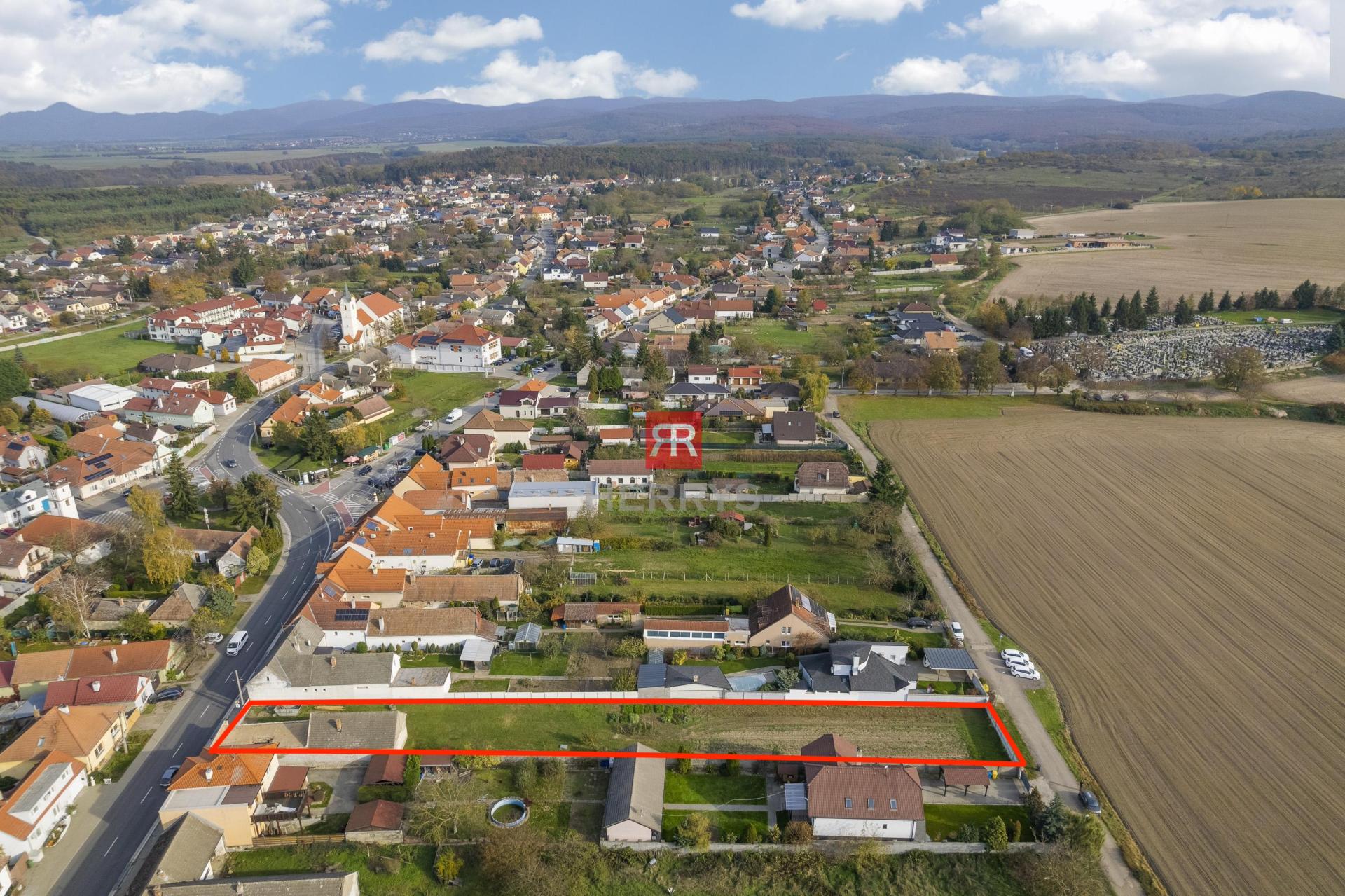 HERRYS - sale of lucrative land in the center of Lozorno 1697 m2. Access from both sides.